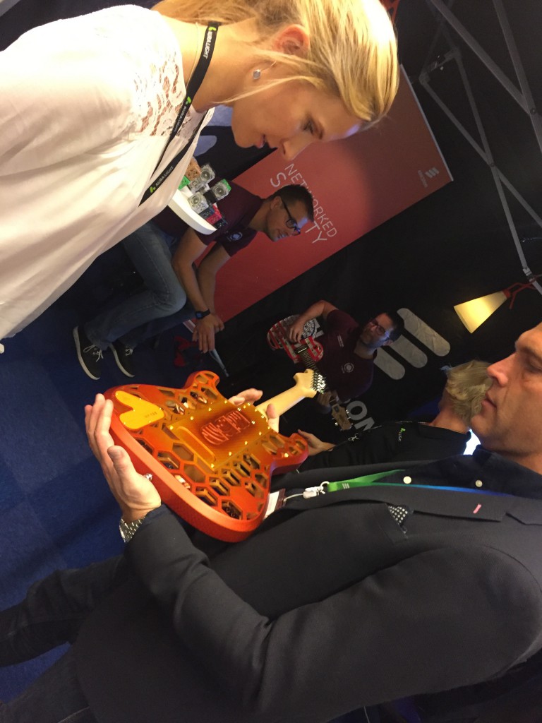 Martin Wallin of Ericsson with one of the 3D printed guitars, Andreas Larsson playing the other one in the back.
